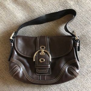 Brown Coach purse.